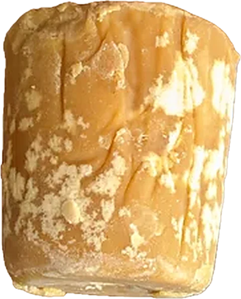 A block of light golden Good Farm chikki jaggery