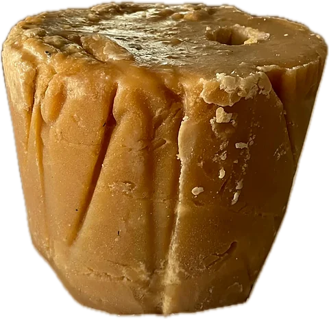 A large unwrapped 5 kg block of Good Farm natural jaggery